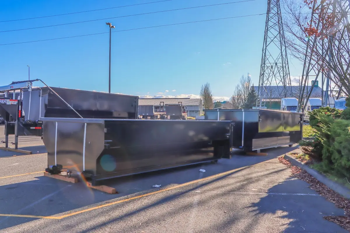 Roll-off dumpster ready for waste disposal at job site for Demolition Dumpster Rental in Flat Rock